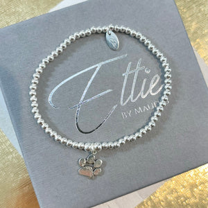 
            
                Load image into Gallery viewer, Ettie Thinbead Solid Paw Print Bracelet
            
        